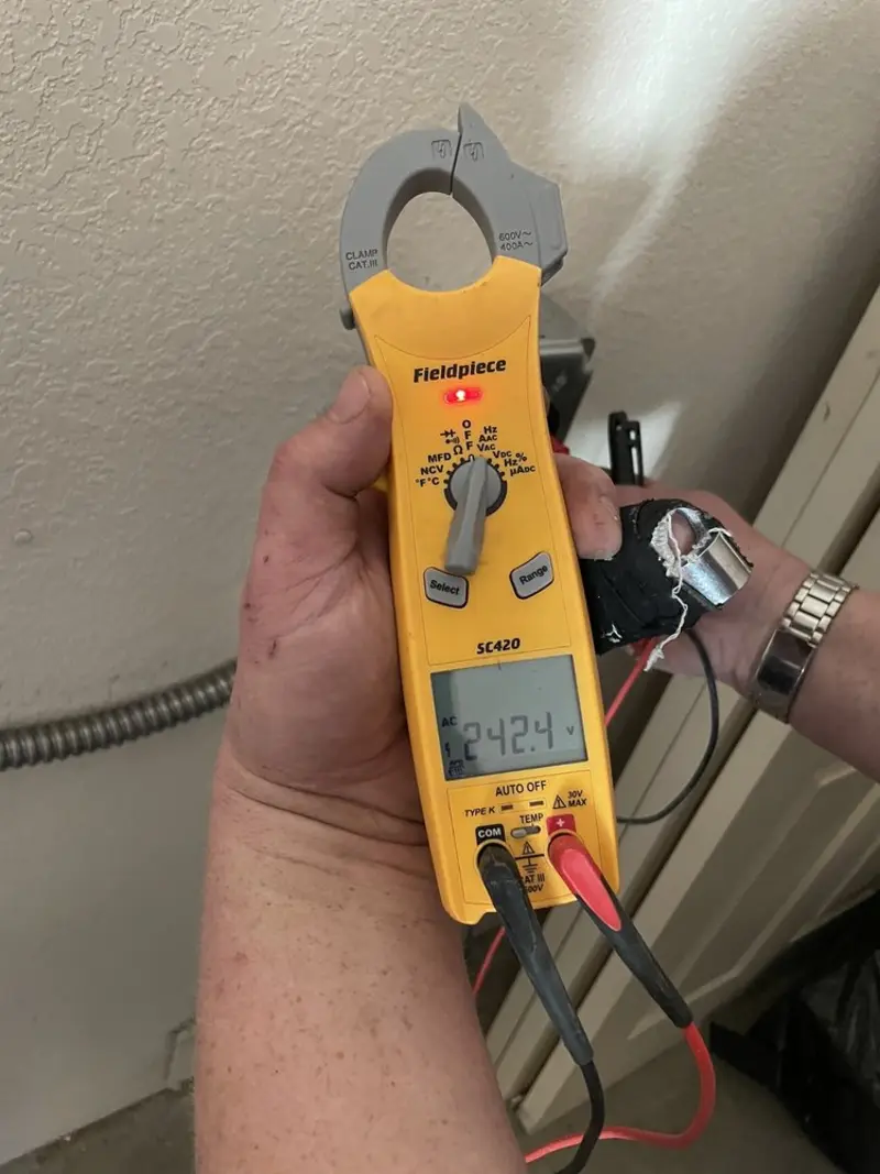 Voltage testing with clamp meter during Recessed Lighting Installation in Berkley